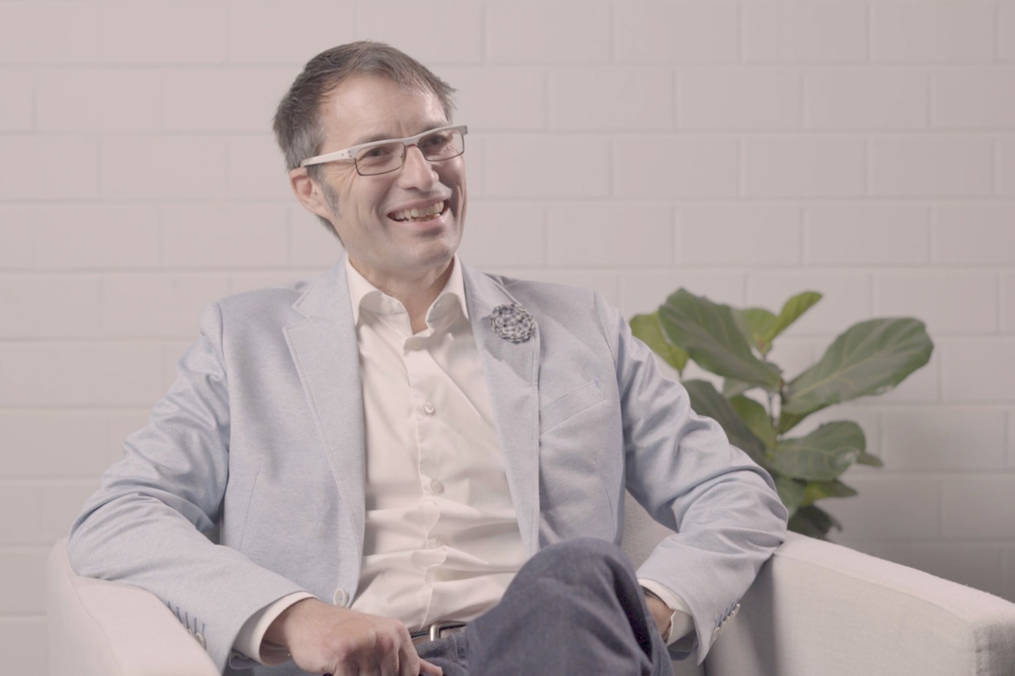 RPS Director - Energy Operations, Australia Asia Pacific, Roger Edgecombe, sits in an armchair smiling with a pot plant behind him.