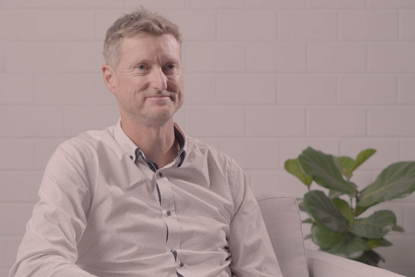 RPS’ Executive Director – MetOcean Science and Technology, Murray Burling sits on an armchair and smiles looking ahead with a pot plant behind him.  